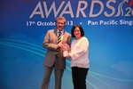 Ms Noryate Bte Abdul Rahman, Cargo Manager Singapore, accepting the âOverall Carrier Of The Yearâ award on behalf of Emirates SkyCargo from Mr Willie van Heusden, Chairman of the Federation of Asia Pacific Air Cargo Associations (FAPAA), at the Payload Asia Awards 2013. (Credit: Payload Asia) Overall Carrier of the Year Award.JPG